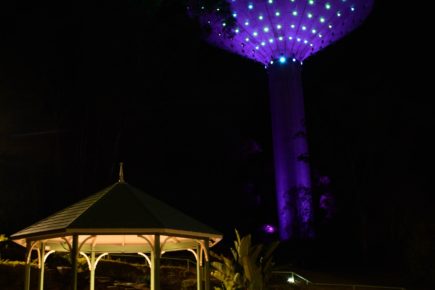 A photo of the Wineglass Water Tower with lights on.