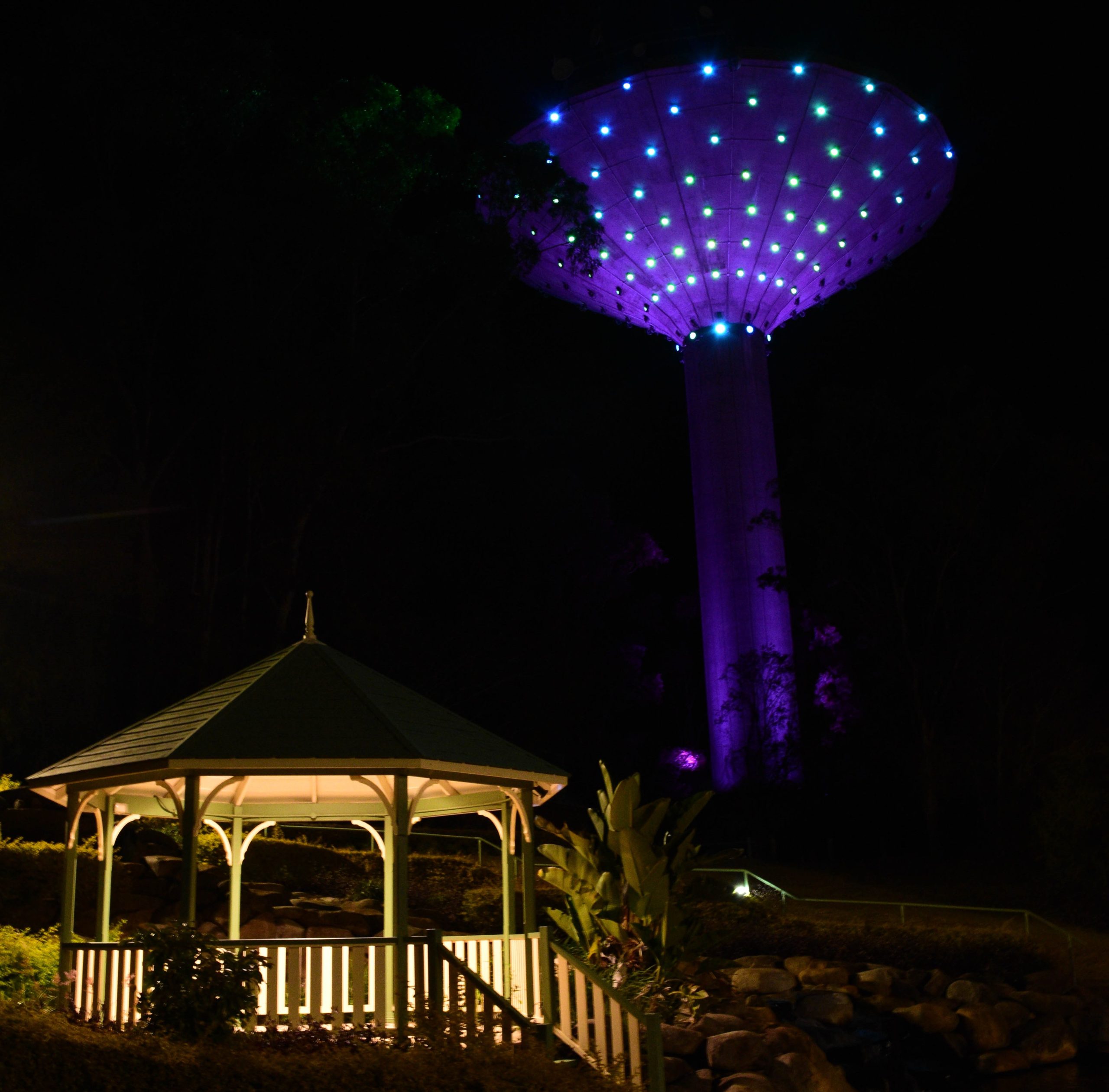 A photo of the Wineglass Water Tower with lights on.